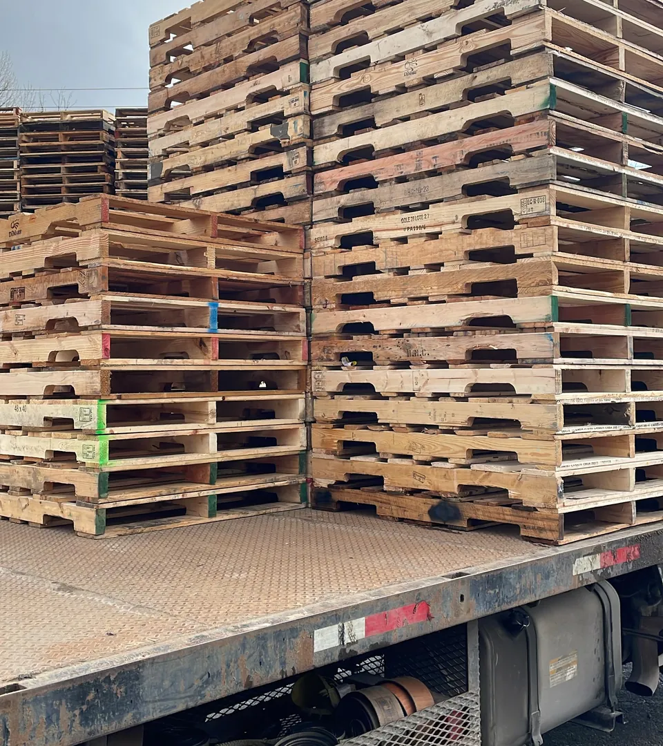 Flatbed truck loaded with 48x40 wood pallets for delivery in the Lower Mainland